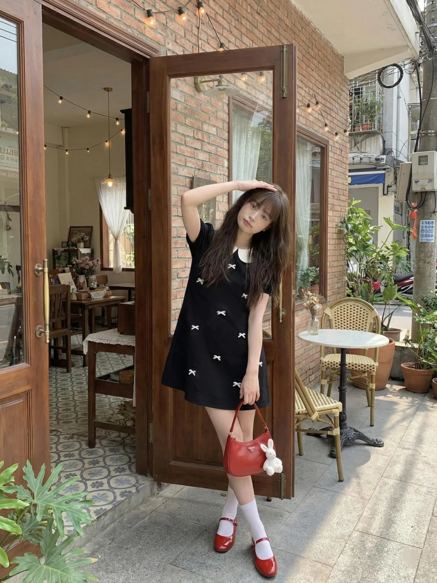  Đầm babydoll đen full nơ 