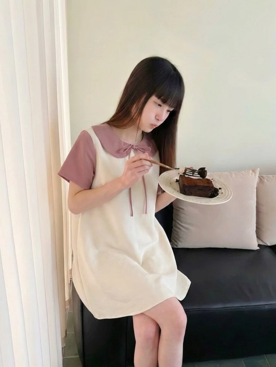 Đầm babydoll kem phối hồng nơ