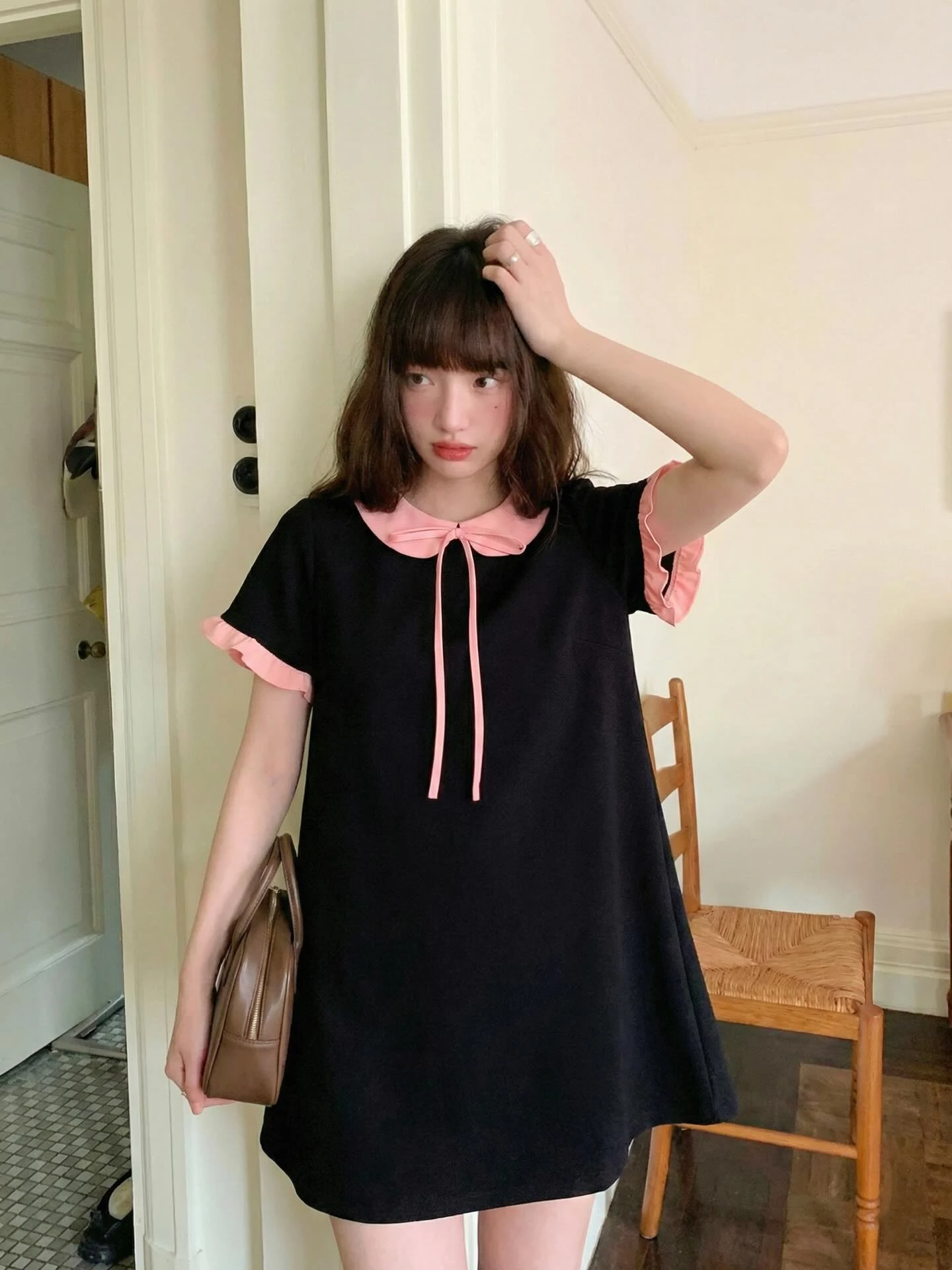 Đầm babydoll đen phối hồng bèo