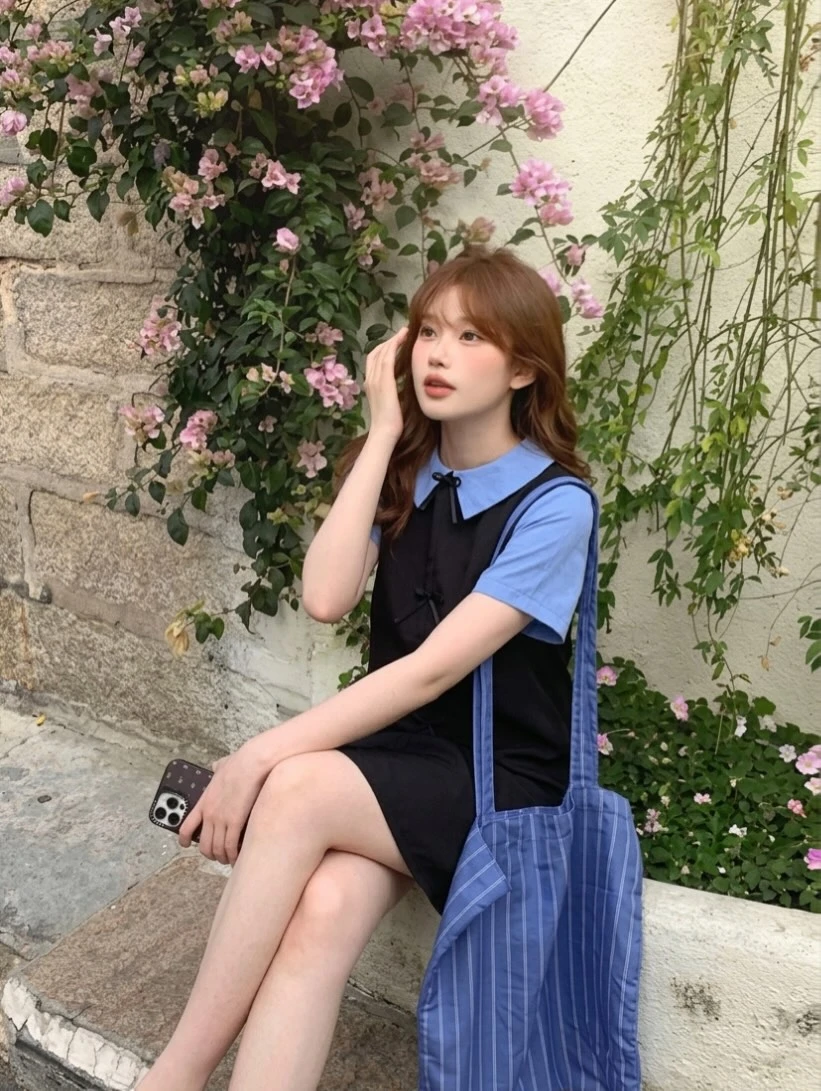 Đầm babydoll đen nơ phối cỗ + tay xanh dương