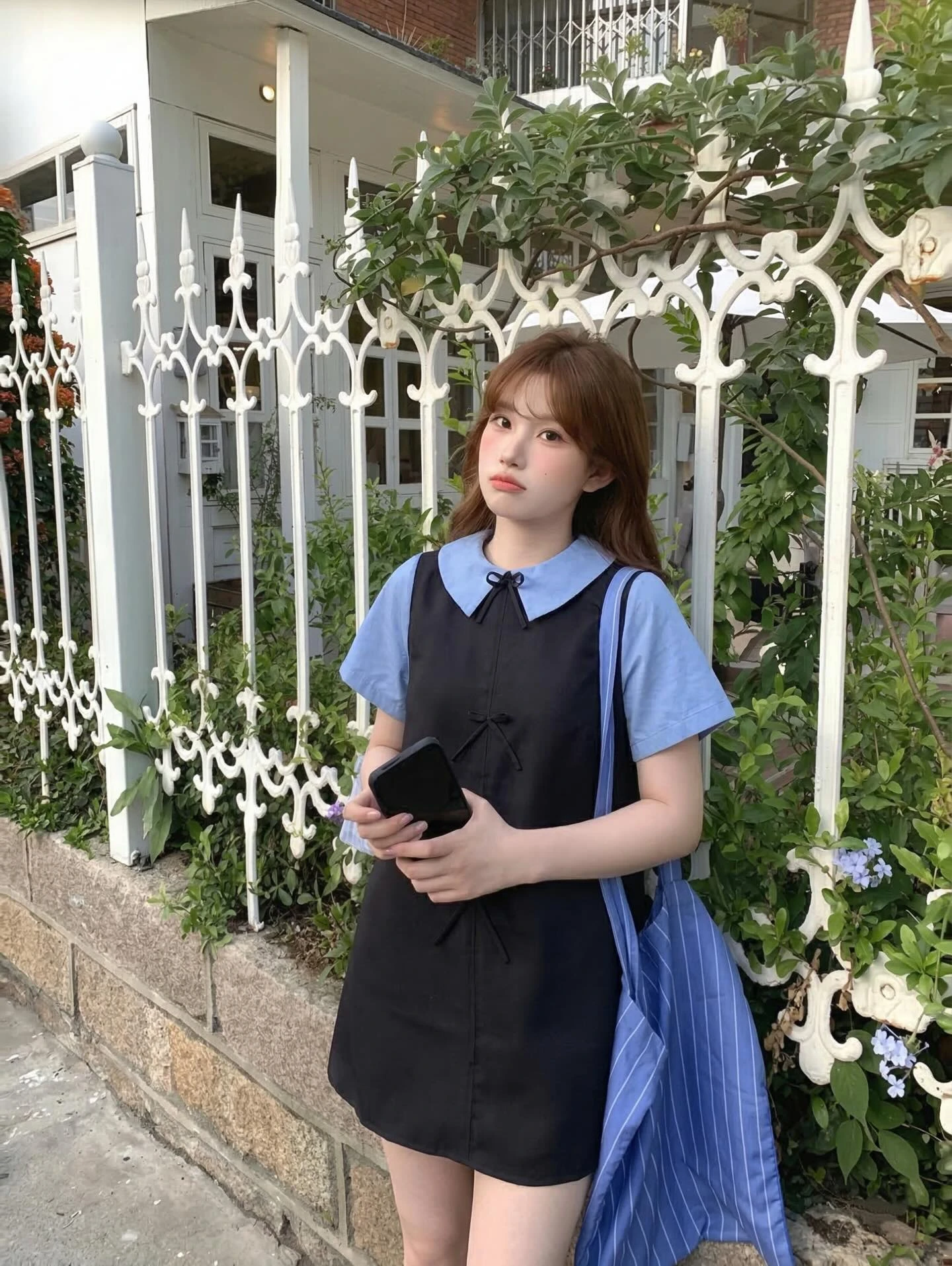 Đầm babydoll đen nơ phối cỗ + tay xanh dương