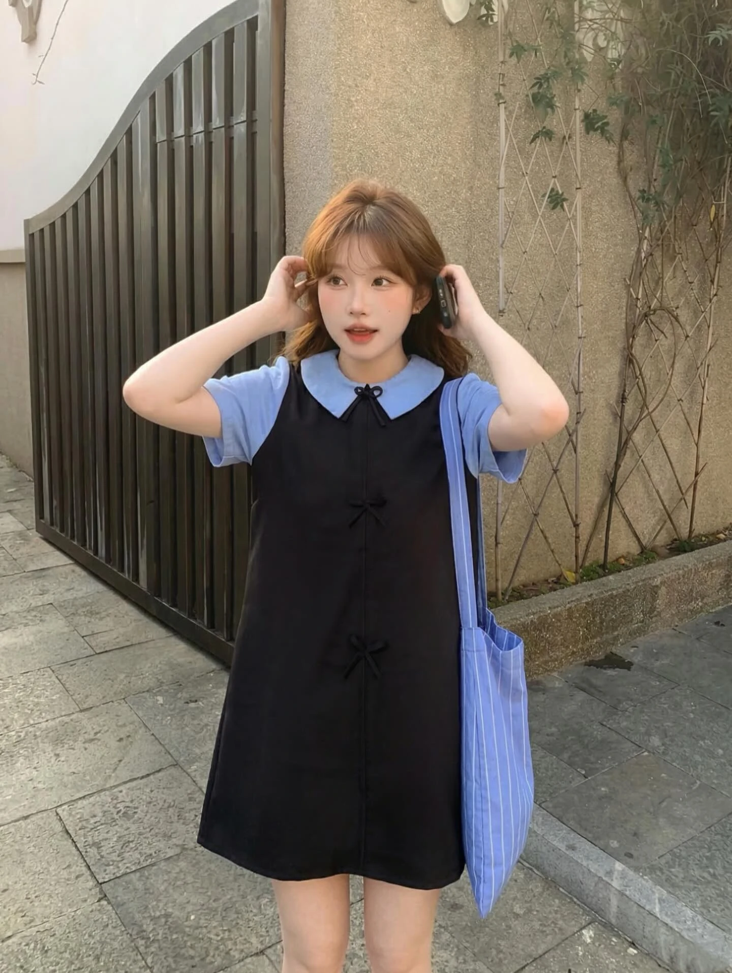 Đầm babydoll đen nơ phối cỗ + tay xanh dương