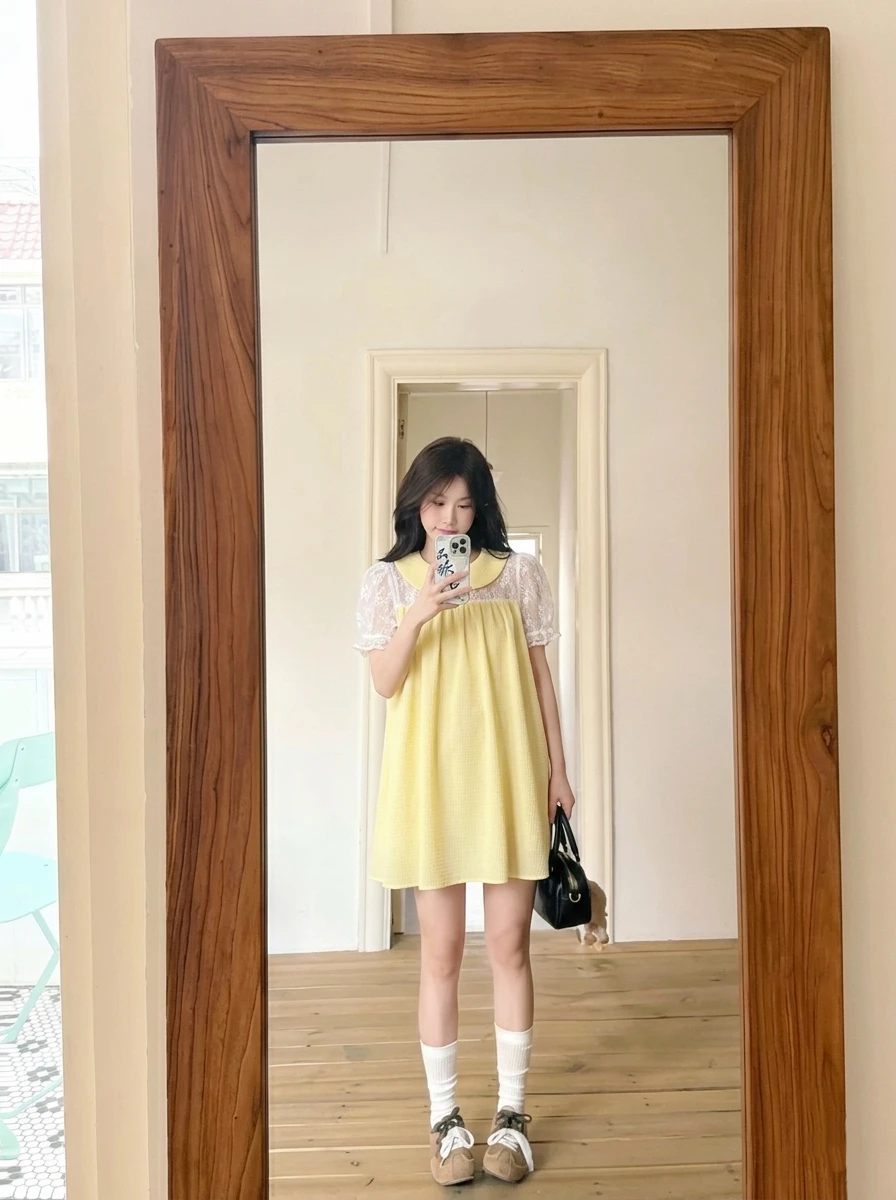 Đầm babydoll vàng phối ren 